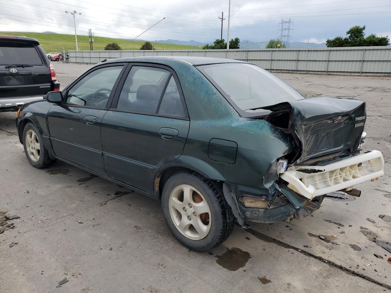 1999 Mazda Protege VIN JM1BJ2210X0150711 Copart auction photo, rear end damage thumbnail 2