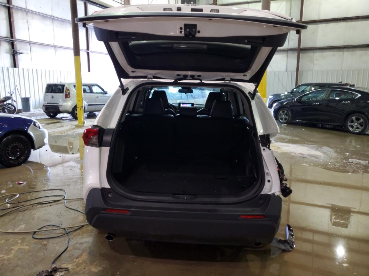 2023 Toyota RAV 4 VIN JTMF1RFV8PD101966 Copart auction photo, rear end / side damage thumbnail 6