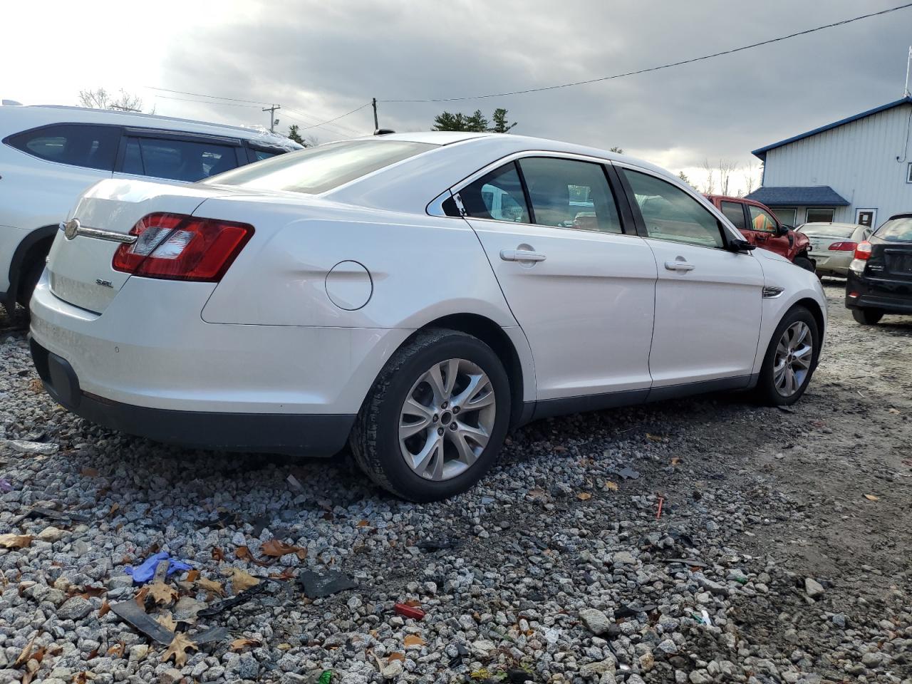 2011 Ford Taurus VIN 1FAHP2EWXBG112005 Copart auction photo, vandalism / side damage thumbnail 3