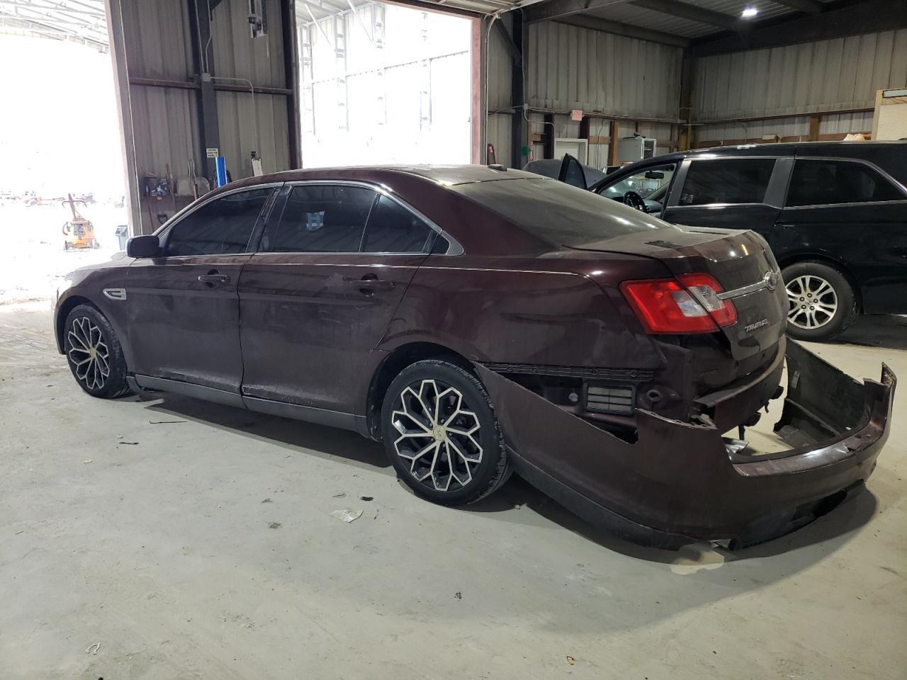 2010 Ford Taurus VIN 1FAHP2DW4AG169008 Copart auction photo, rear end / minor dent/scratches damage thumbnail 2
