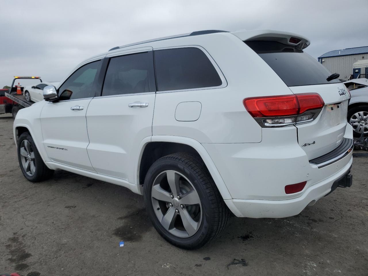 2015 Jeep Grand Cherokee VIN 1C4RJFCG5FC605090 Copart auction photo, top/roof damage thumbnail 2