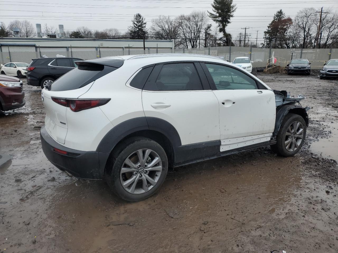 2023 Mazda CX-30 VIN 3MVDMBBM1PM569236 Copart auction photo, front end damage thumbnail 3
