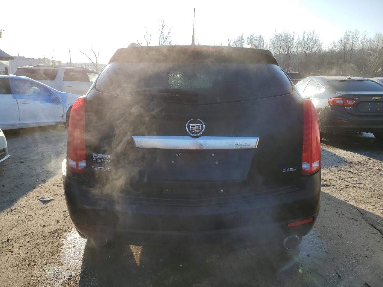 2012 Cadillac SRX VIN 3GYFNDE30CS578435 Copart auction photo, rear end damage thumbnail 6