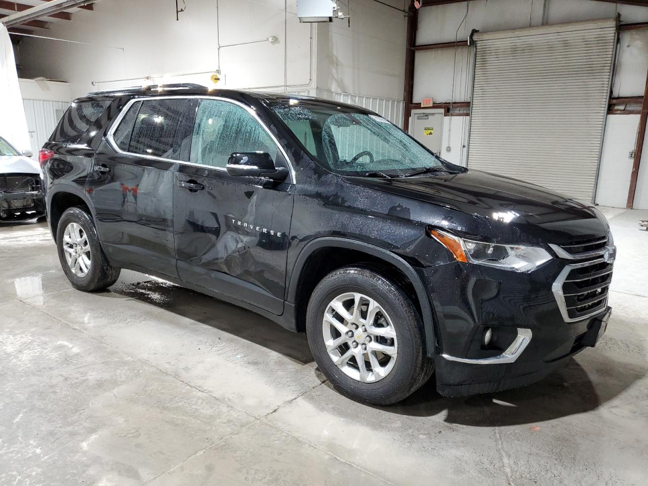 2021 Chevrolet Traverse VIN 1GNEVGKW0MJ257698 Copart auction photo, side / front end damage thumbnail 4