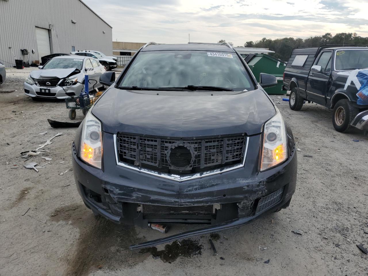 2015 Cadillac SRX VIN 3GYFNBE34FS555314 Copart auction photo, front end damage thumbnail 5
