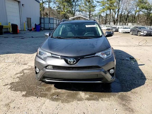 2018 Toyota RAV 4 VIN 2T3WFREV7JW511025 Copart auction photo, side / front end damage thumbnail 14