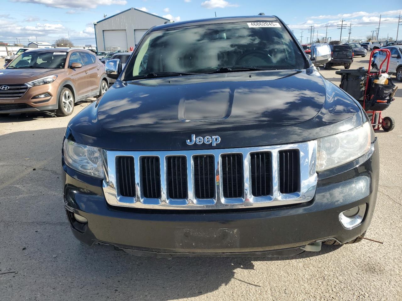 2013 Jeep Grand Cherokee VIN 1C4RJFBT0DC573595 Copart auction photo, front end / undercarriage damage thumbnail 5