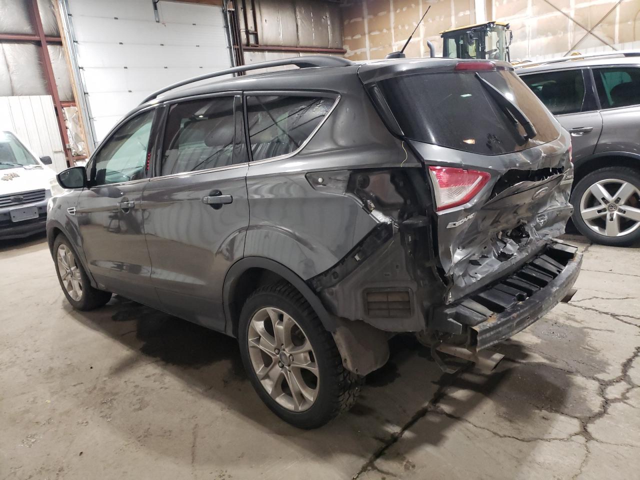 2015 Ford Escape VIN 1FMCU0GX3FUA98975 Copart auction photo, rear end / all over damage thumbnail 2