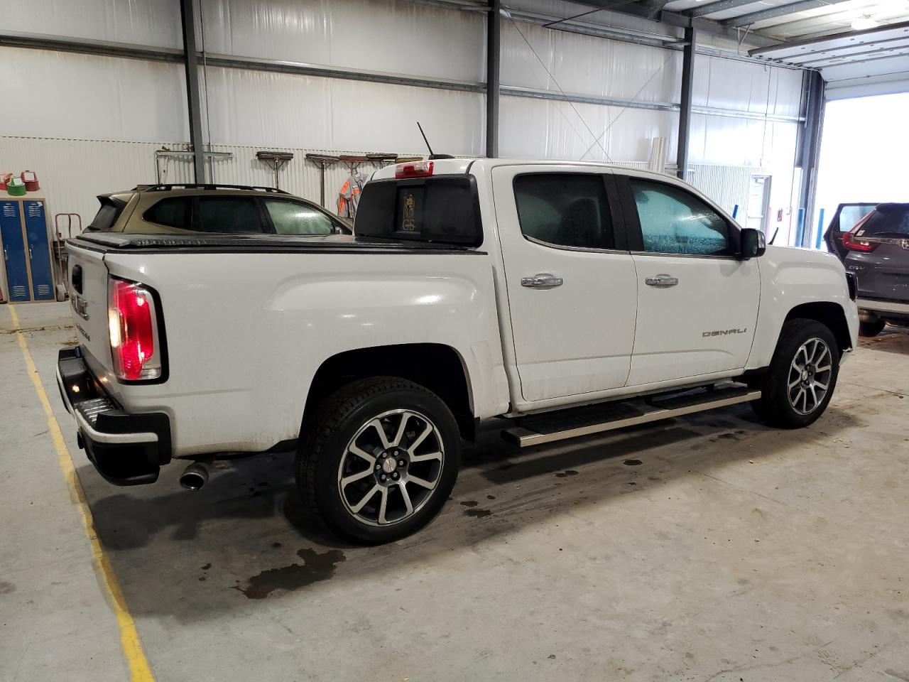 2021 GMC Canyon VIN 1GTG6EEN8M1280992 Copart auction photo, front end / hail damage thumbnail 3