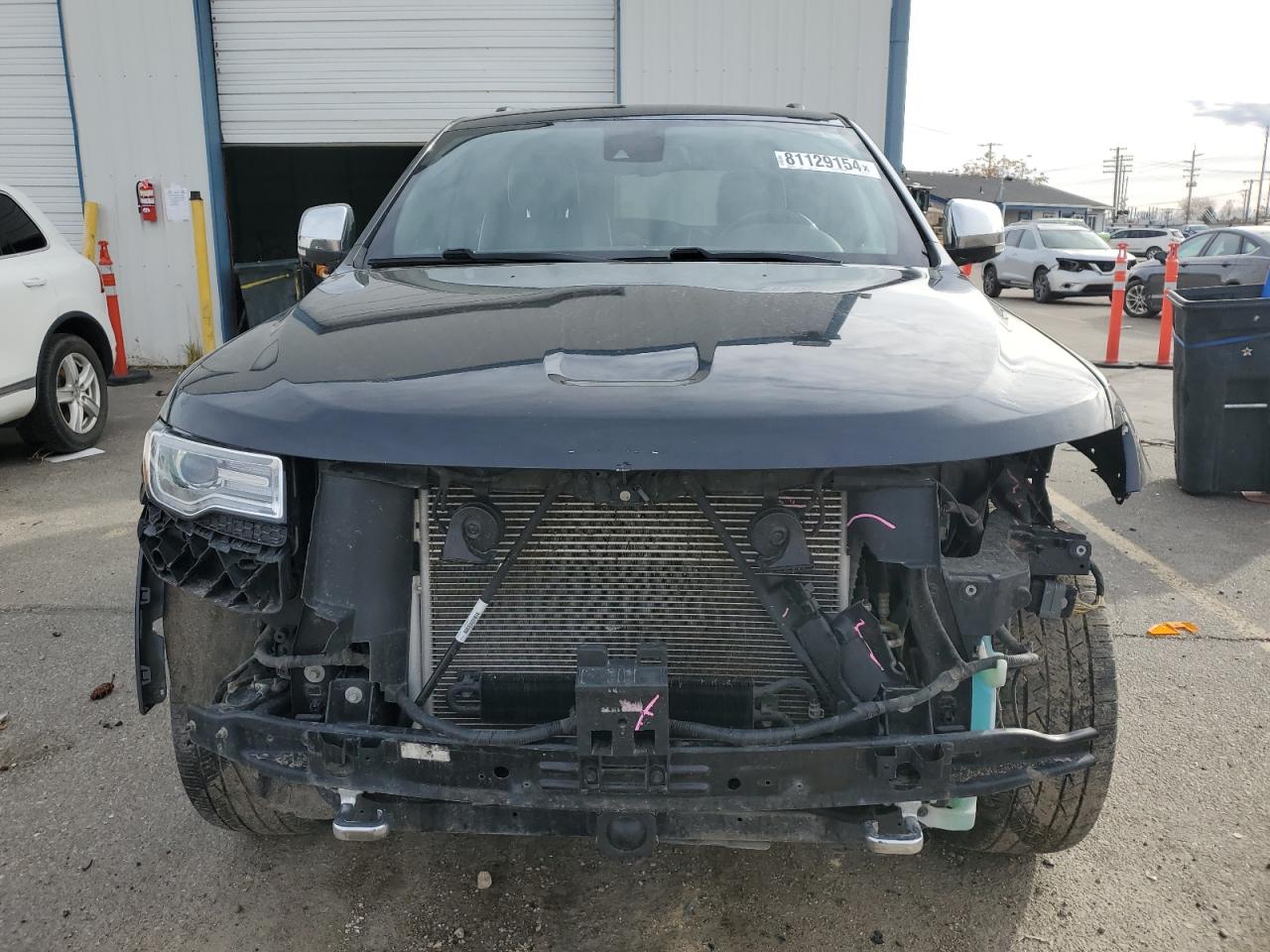 2015 Jeep Grand Cherokee VIN 1C4RJFCG7FC822463 Copart auction photo, front end / undercarriage damage thumbnail 5