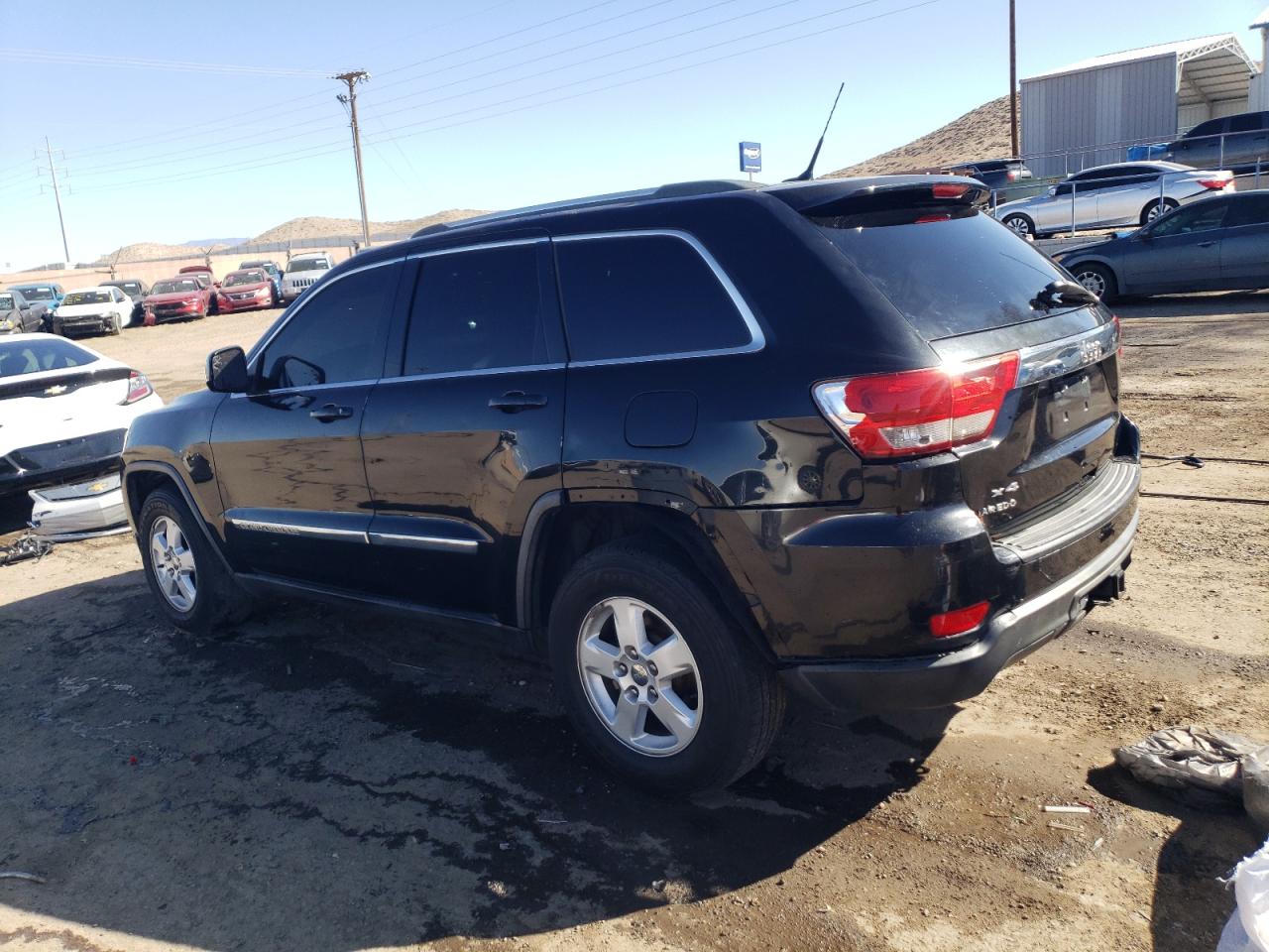 2011 Jeep Grand Cherokee VIN 1J4RR4GG5BC514557 Copart auction photo, side / front end damage thumbnail 2