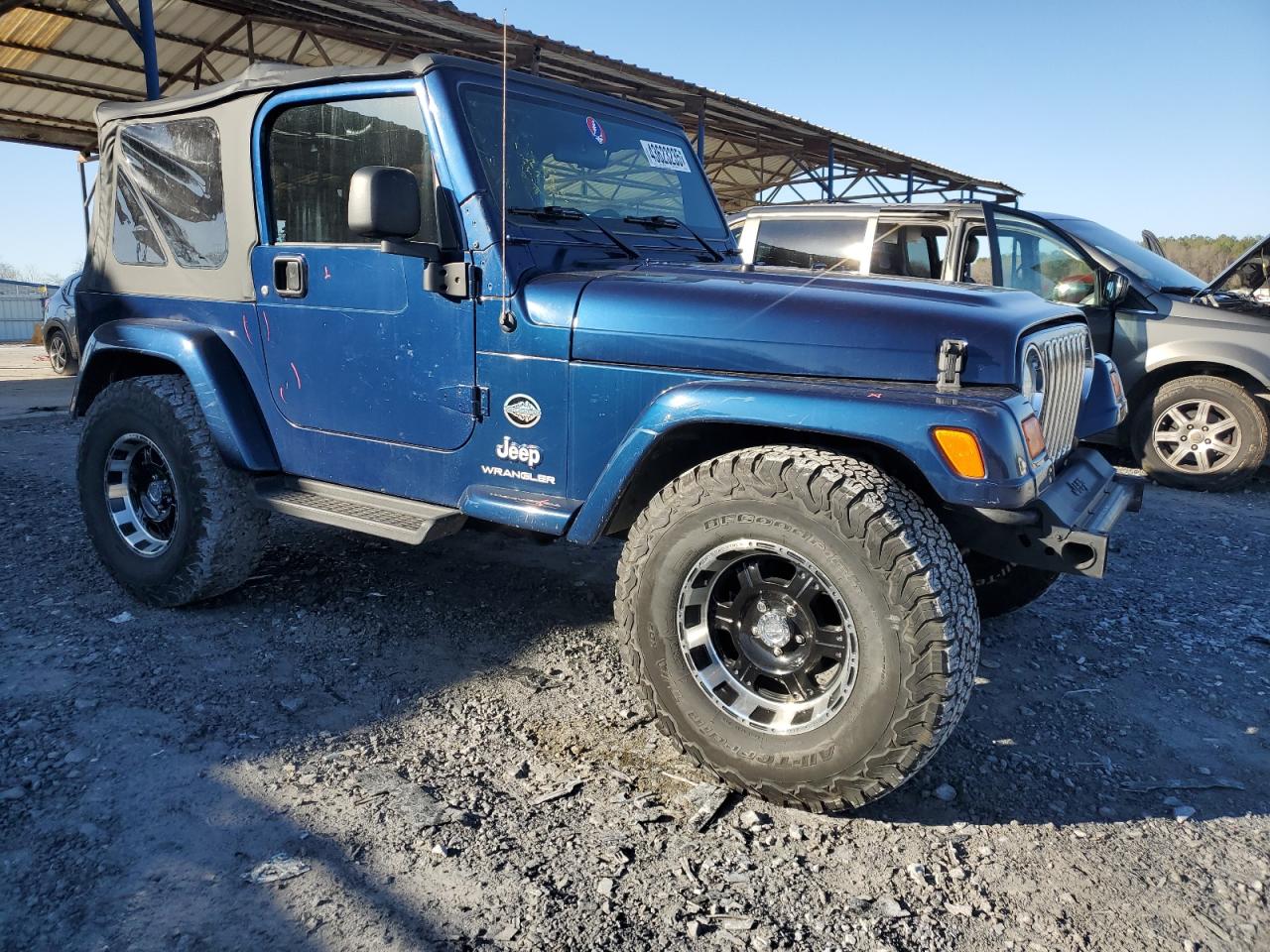 2005 Jeep Wrangler VIN 1J4FA39SX5P370040 Copart auction photo, rear end / minor dent/scratches damage thumbnail 4