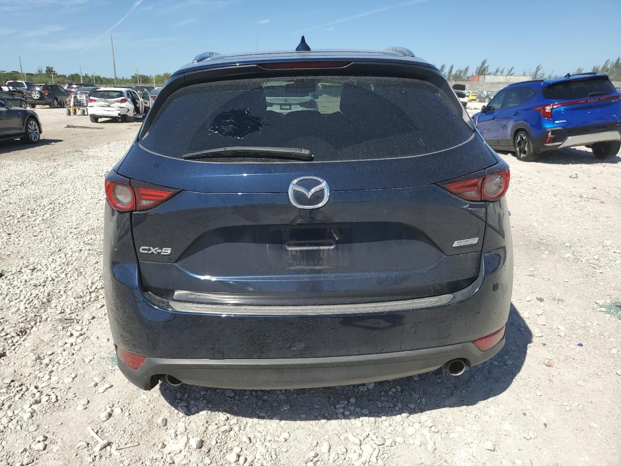 2018 Mazda CX-5 VIN JM3KFADM4J1411057 Copart auction photo, side / rear end damage thumbnail 6
