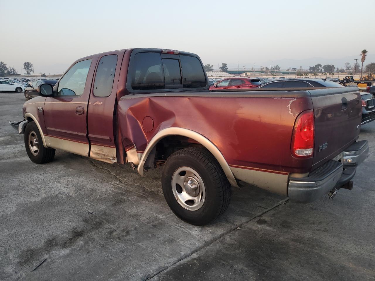 1999 Ford F-150 VIN 1FTRX17L5XNB00326 Copart auction photo, all over damage thumbnail 2