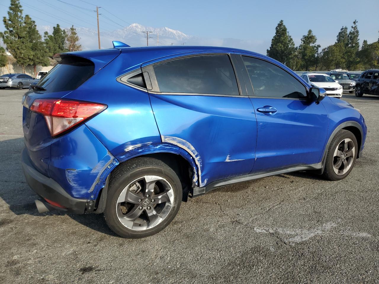 2018 Honda HR-V VIN 3CZRU5H50JM718083 Copart auction photo, side / undercarriage damage thumbnail 3