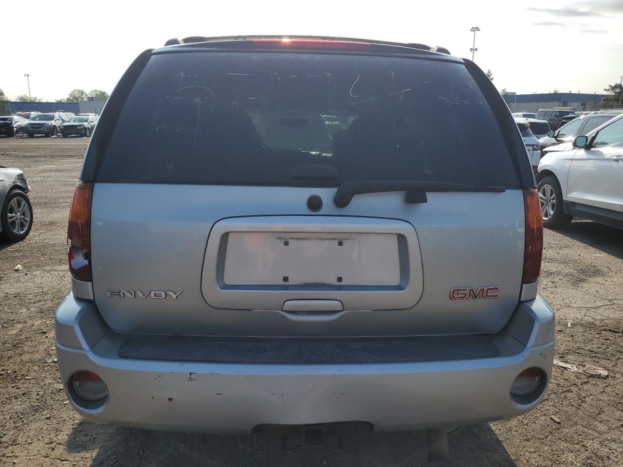 2007 GMC Envoy VIN 1GKDT13S472232289 Copart auction photo, rear end / missing/altered vin damage thumbnail 6