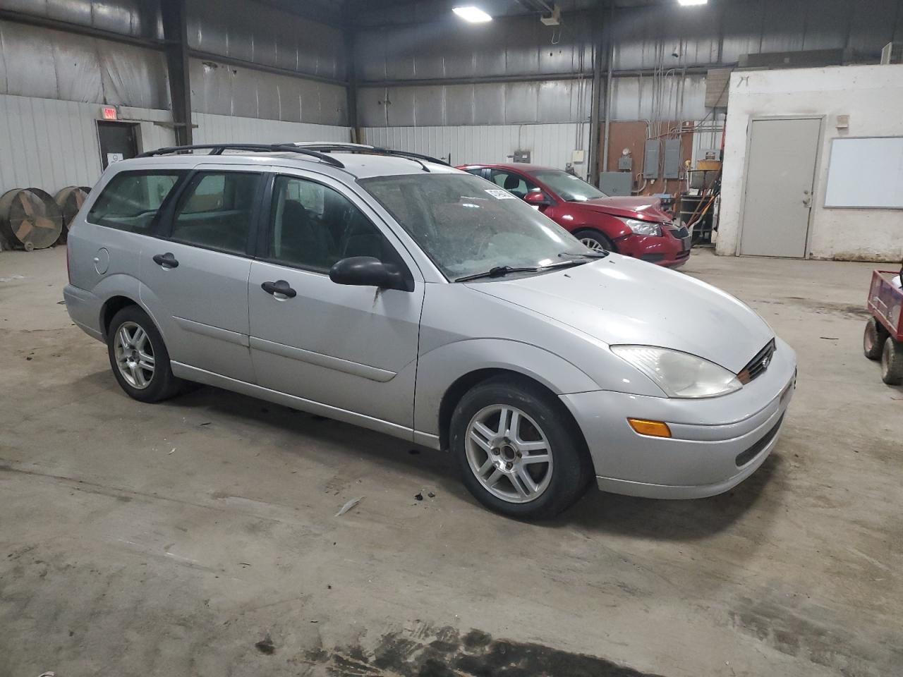 2000 Ford Focus VIN 1FAFP36P9YW136203 Copart auction photo, front end / side damage thumbnail 4