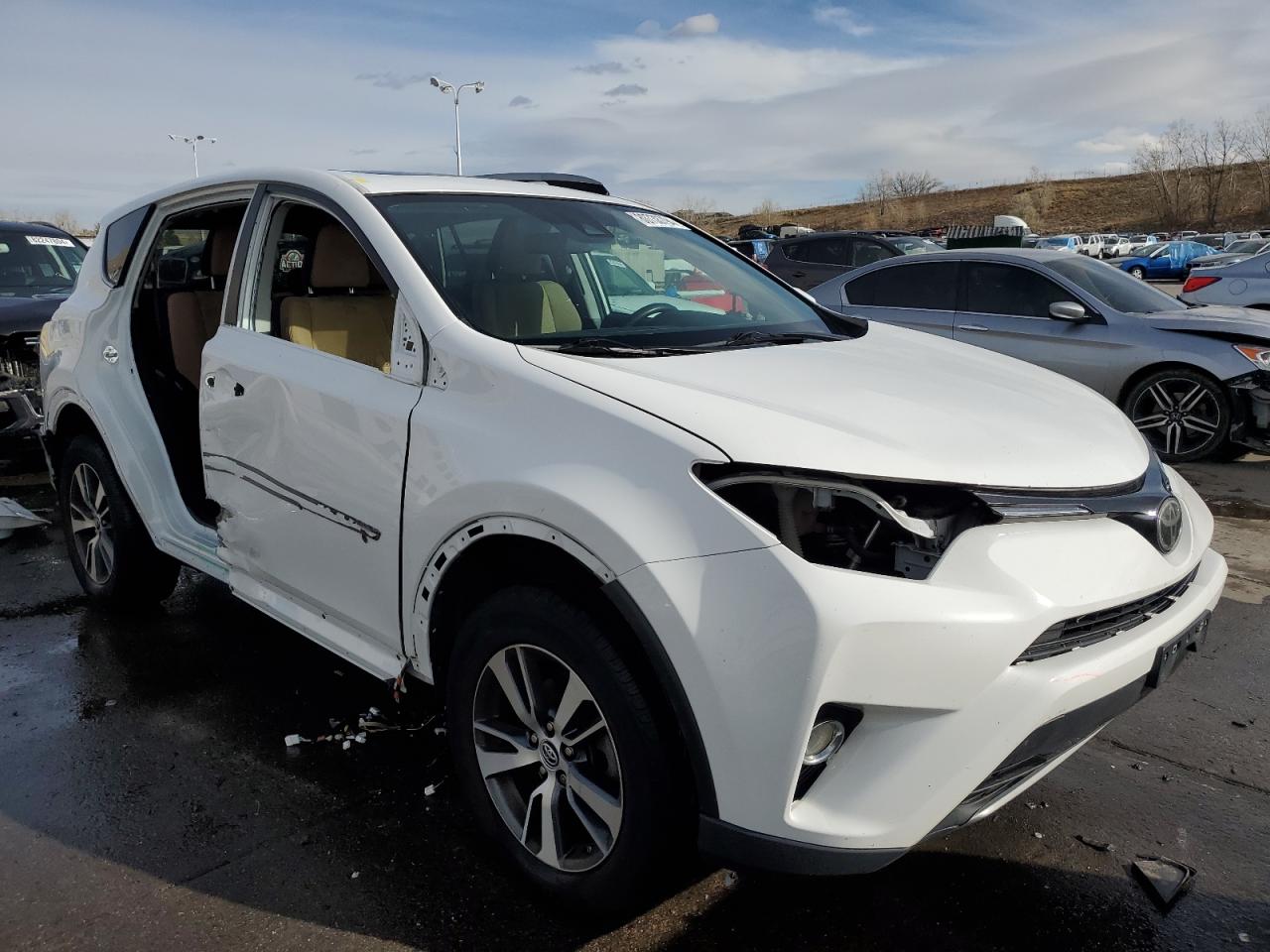 2017 Toyota RAV 4 VIN 2T3RFREV8HW600772 Copart auction photo, side / front end damage thumbnail 4