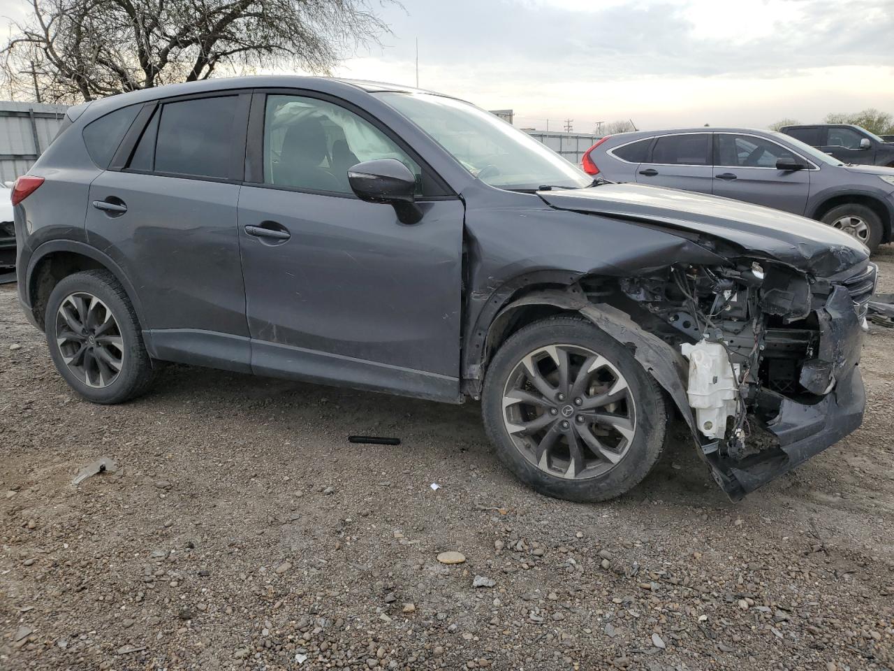 2016 Mazda CX-5 VIN JM3KE2DY6G0825855 Copart auction photo, front end / undercarriage damage thumbnail 4
