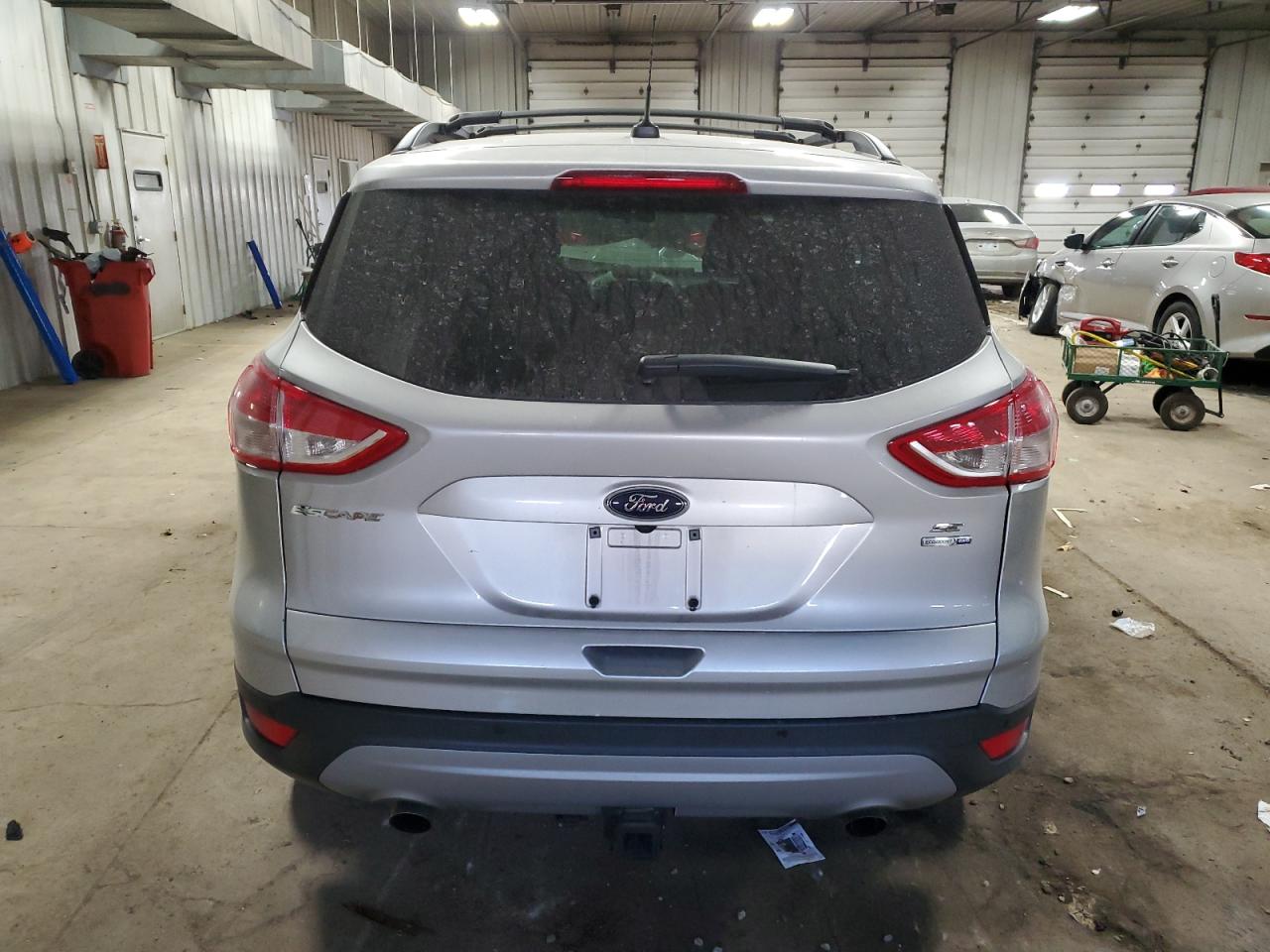 2016 Ford Escape VIN 1FMCU9G99GUC52628 Copart auction photo, all over damage thumbnail 6
