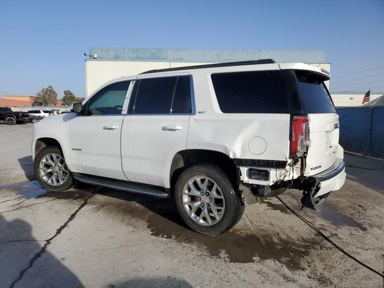 2015 GMC Yukon VIN 1GKS1BKC4FR664092 Copart auction photo, rear end / minor dent/scratches damage thumbnail 2