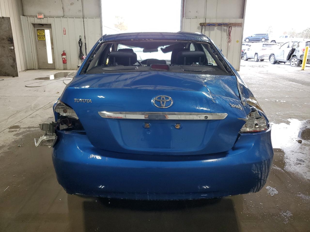 2009 Toyota Yaris VIN JTDBT903491337986 Copart auction photo, rollover damage thumbnail 6