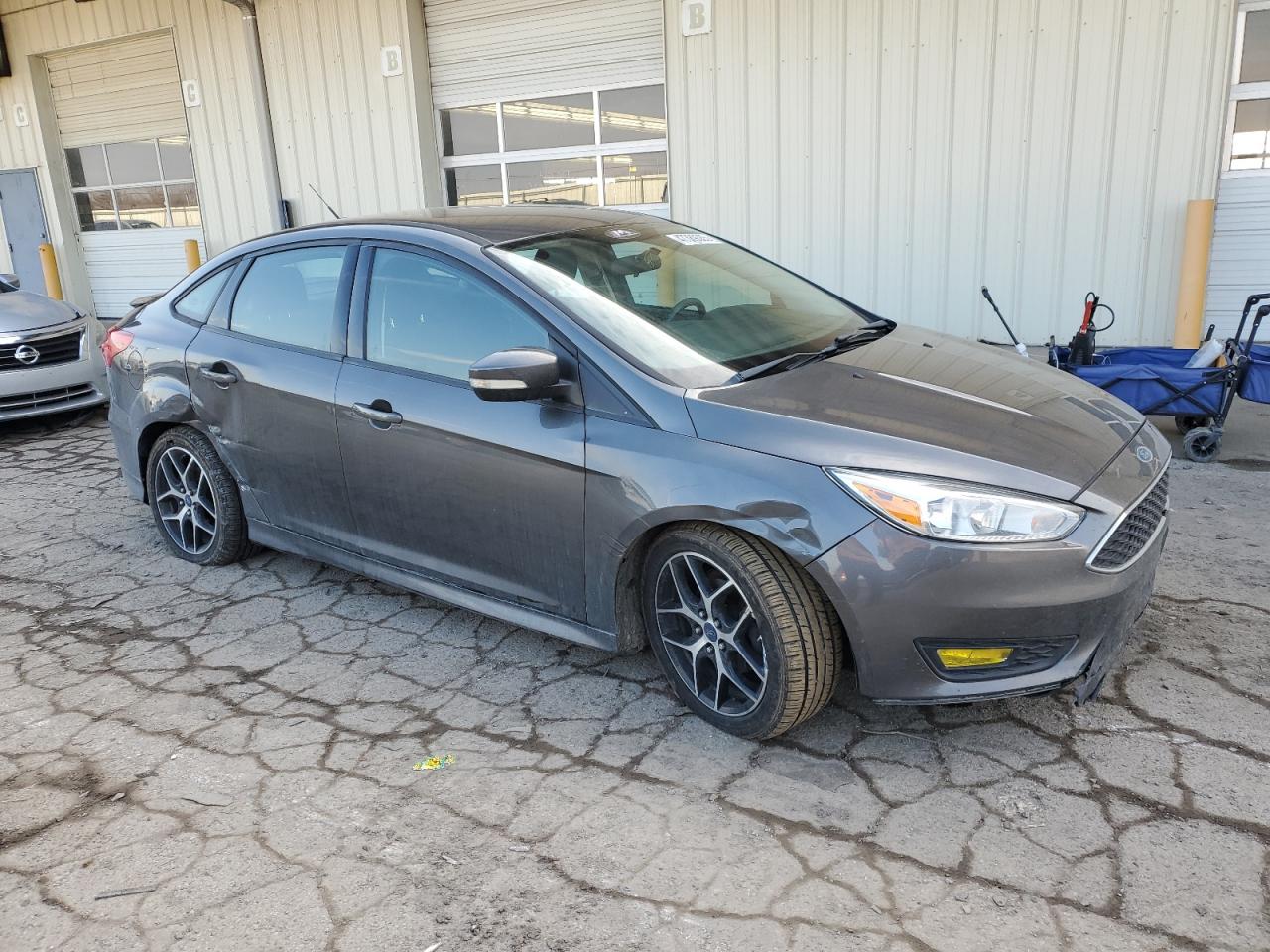 2015 Ford Focus VIN 1FADP3F21FL218355 Copart auction photo, side / front end damage thumbnail 4