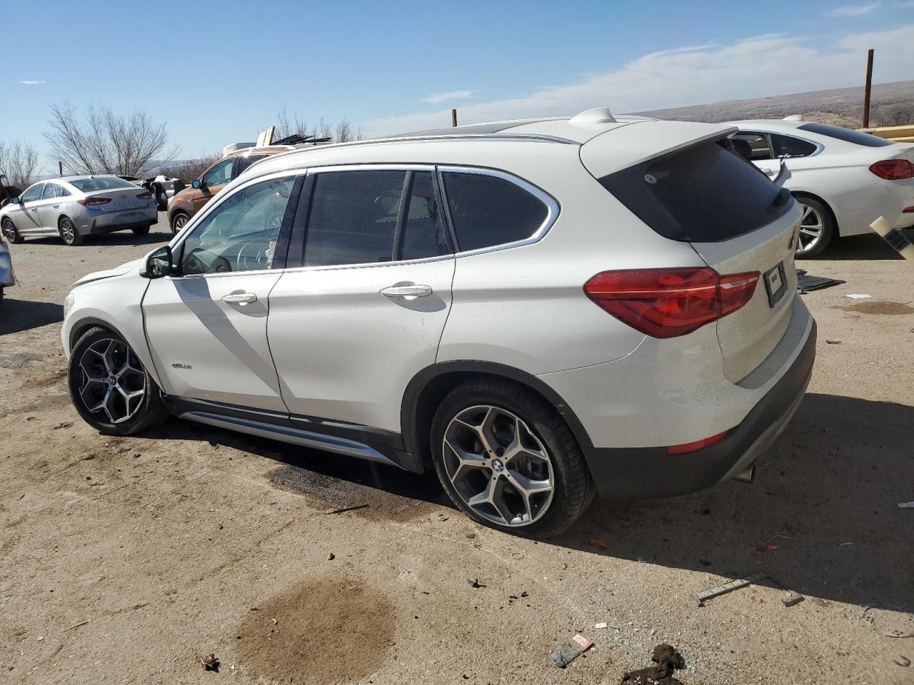 2016 BMW X1 VIN WBXHT3C39GP882341 Copart auction photo, undercarriage damage thumbnail 2