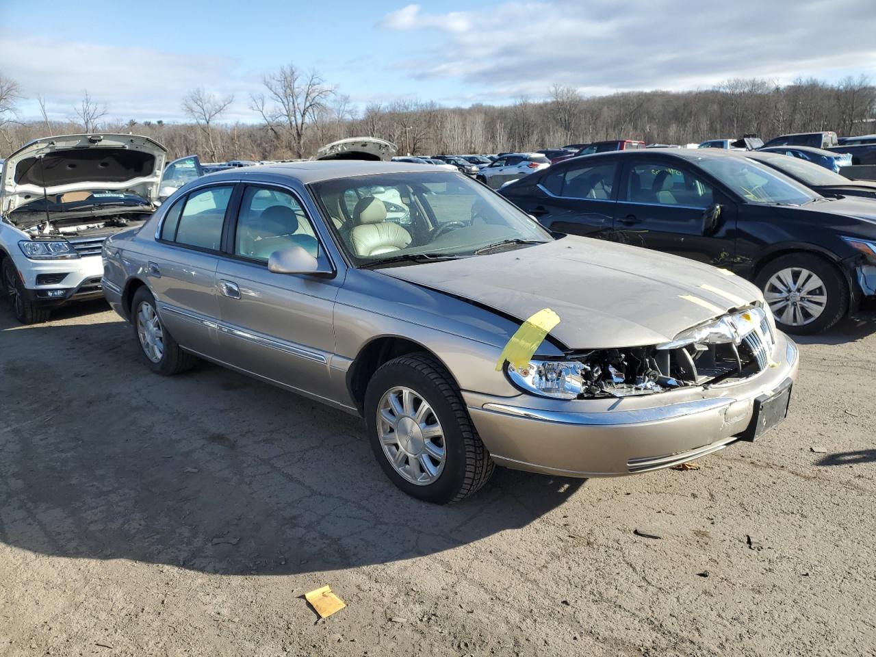 2002 Lincoln Continental VIN 1LNHM97V92Y690473 Copart auction photo, front end / minor dent/scratches damage thumbnail 4