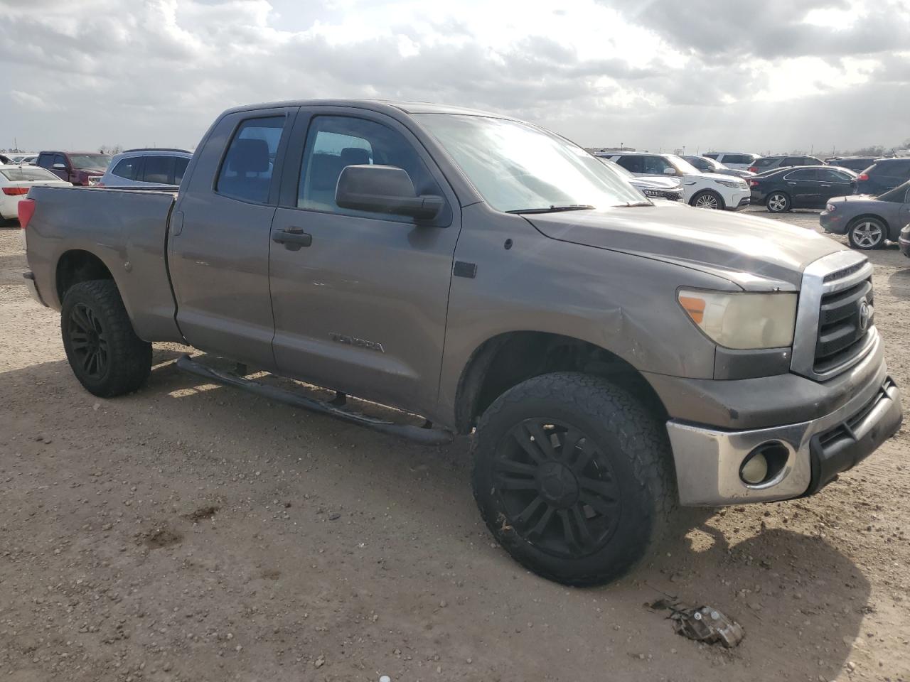 2010 Toyota Tundra VIN 5TFRM5F17AX002507 Copart auction photo, front end / side damage thumbnail 4