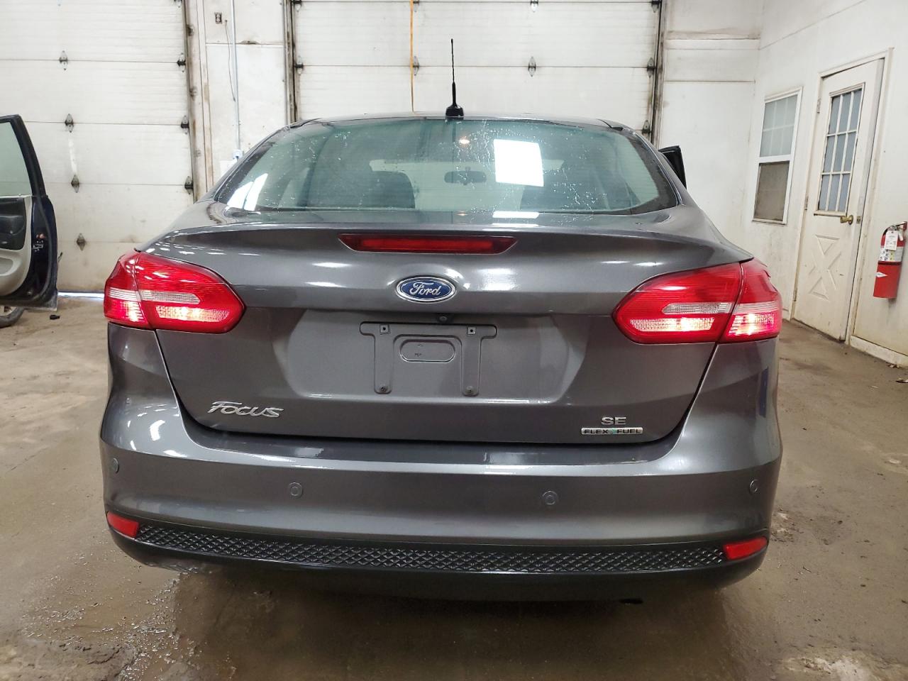 2016 Ford Focus VIN 1FADP3F22GL208385 Copart auction photo, side / front end damage thumbnail 6