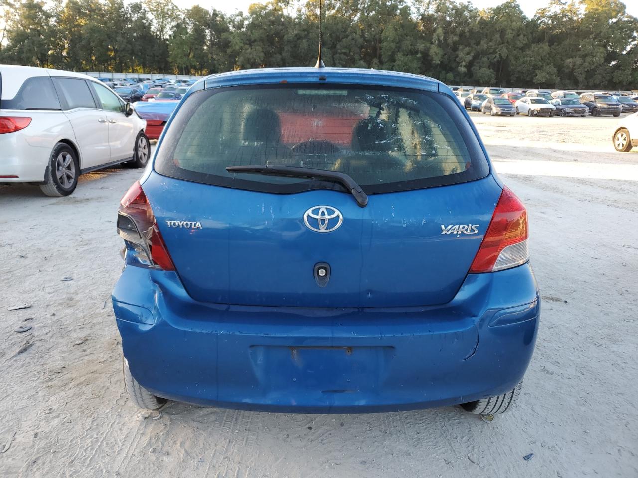 2011 Toyota Yaris VIN JTDKT4K37B5330125 Copart auction photo, front end / rear end damage thumbnail 6