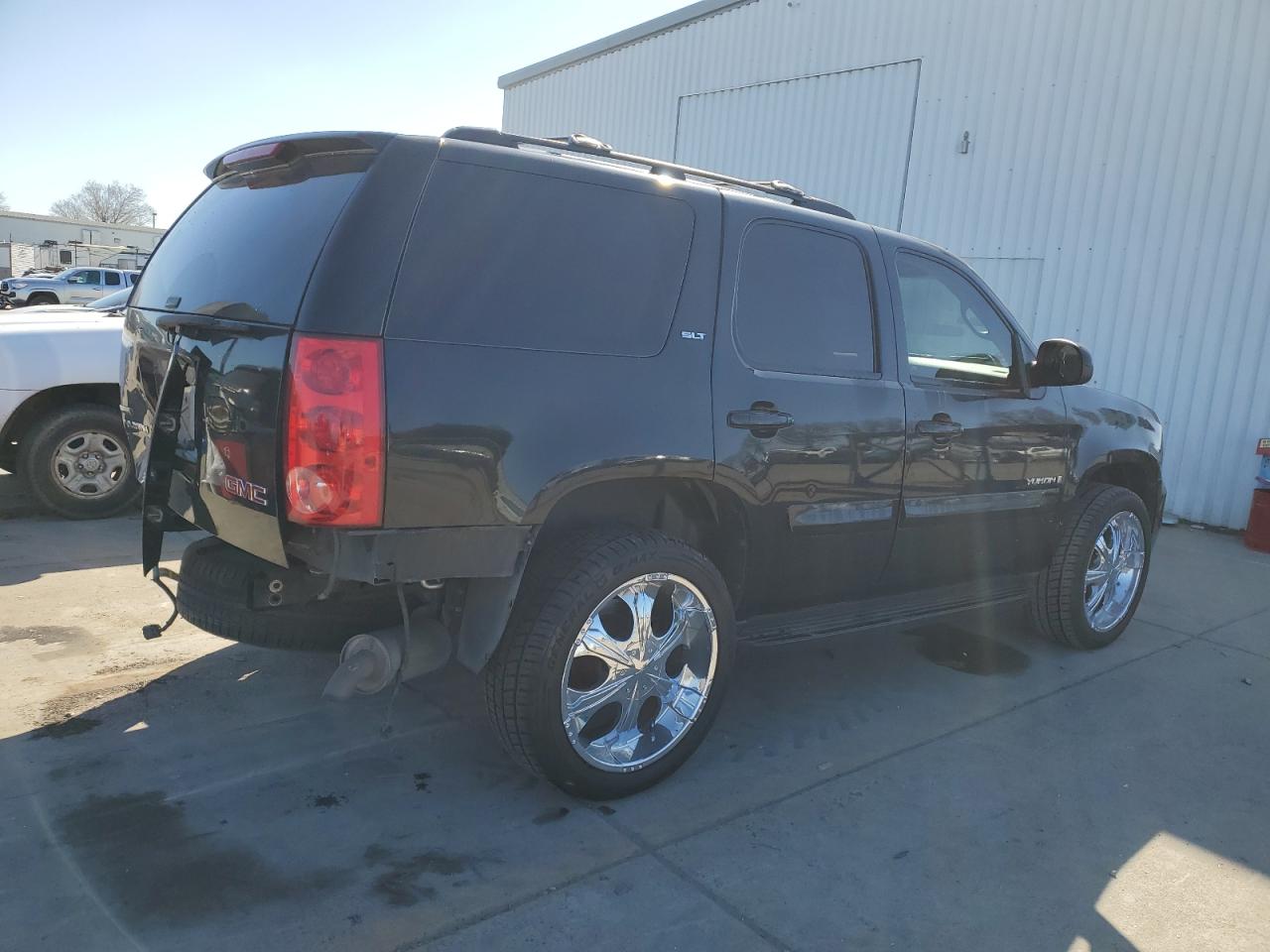2009 GMC Yukon VIN 1GKFK33059R106202 Copart auction photo, rear end damage thumbnail 3