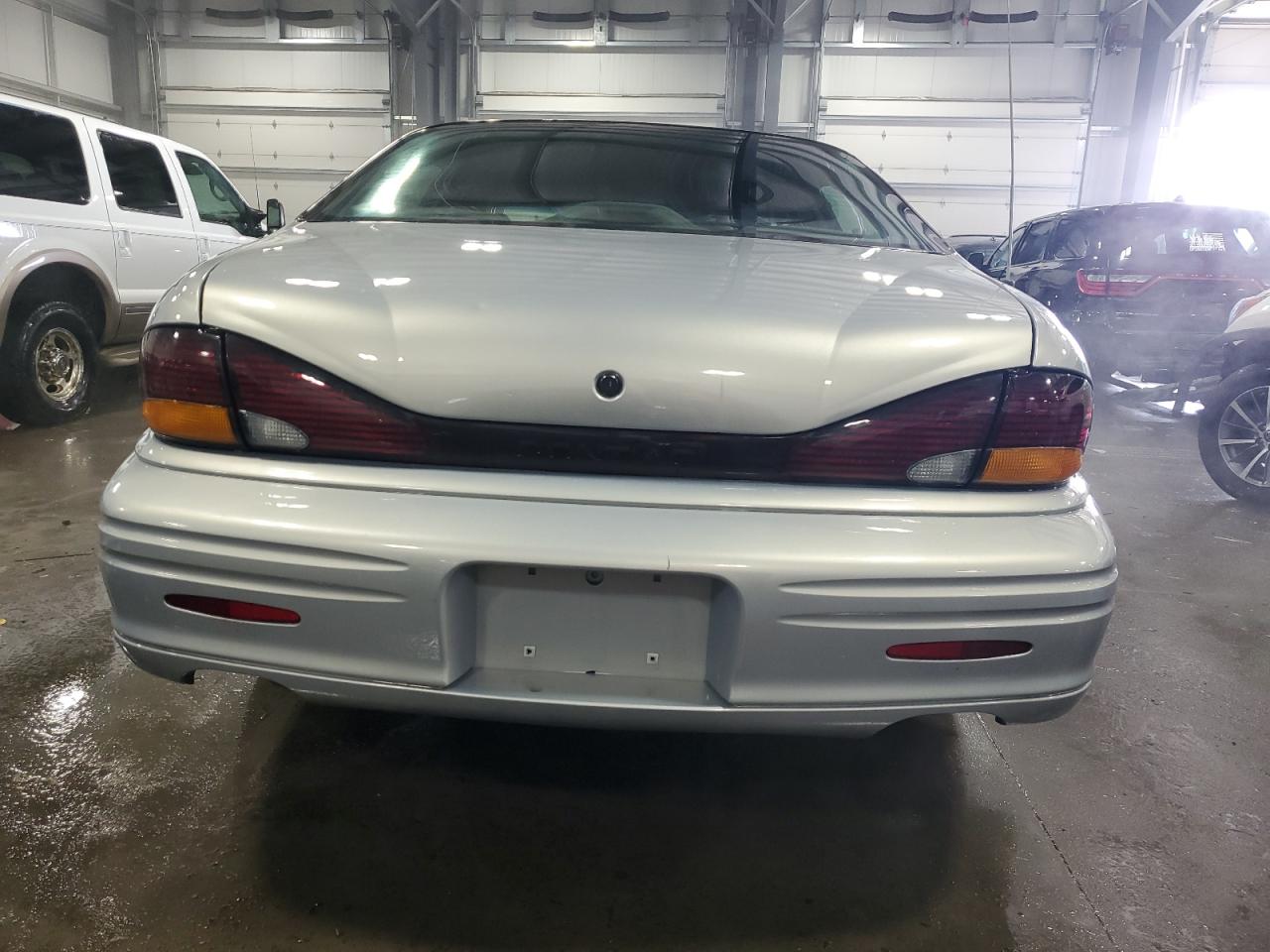 1998 Pontiac Bonneville VIN 1G2HX52K0WH218674 Copart auction photo, front end / rear end damage thumbnail 6