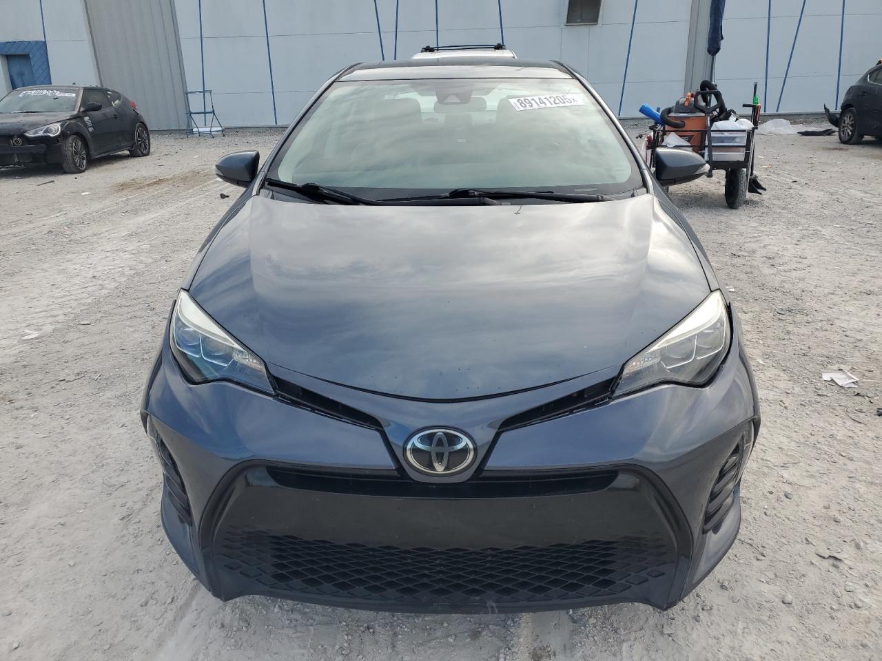2018 Toyota Corolla VIN 5YFBURHE7JP802795 Copart auction photo, side / rear end damage thumbnail 5