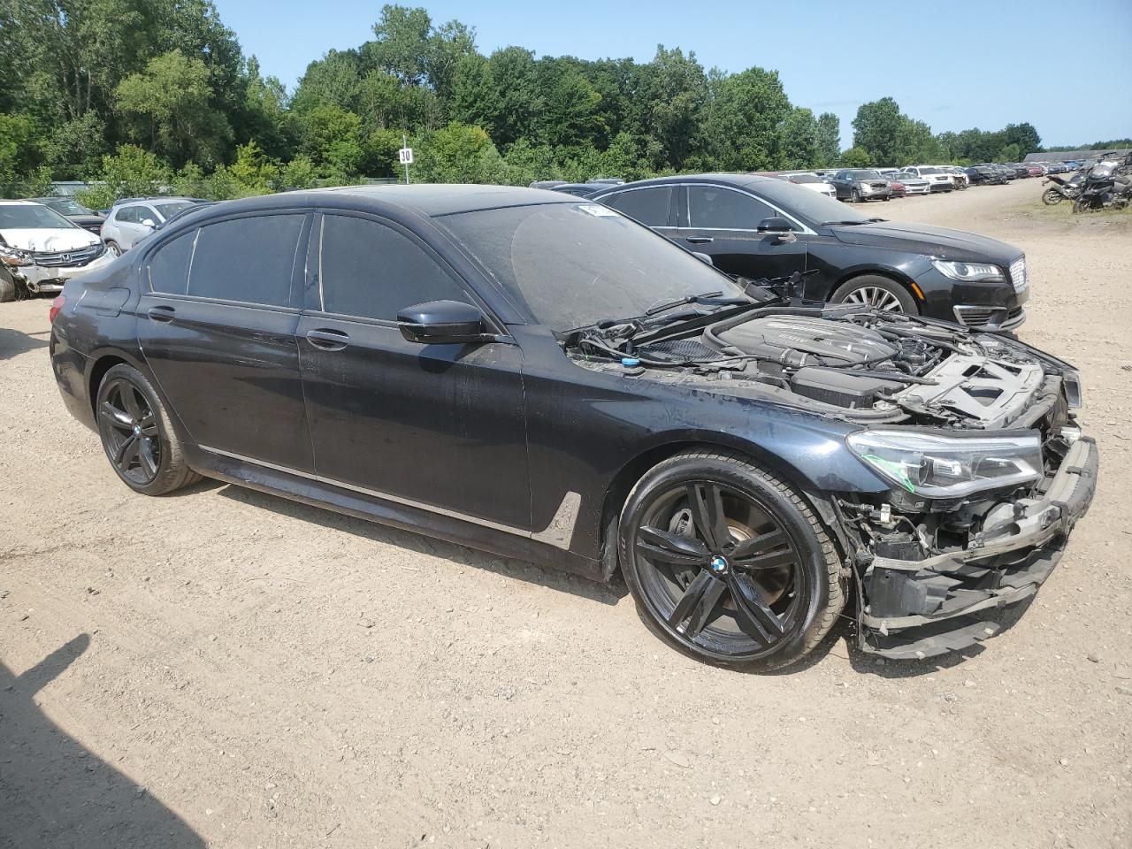2016 BMW 7er VIN WBA7F2C56GG417833 Copart auction photo, front end damage thumbnail 4