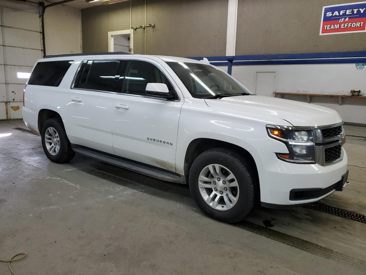2018 Chevrolet Suburban VIN 1GNSKGKC2JR188737 Copart auction photo, front end / side damage thumbnail 4