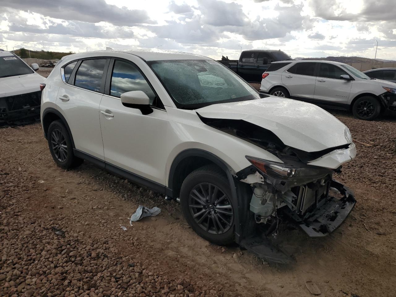 2021 Mazda CX-5 VIN JM3KFBCM3M0339091 Copart auction photo, front end damage thumbnail 4