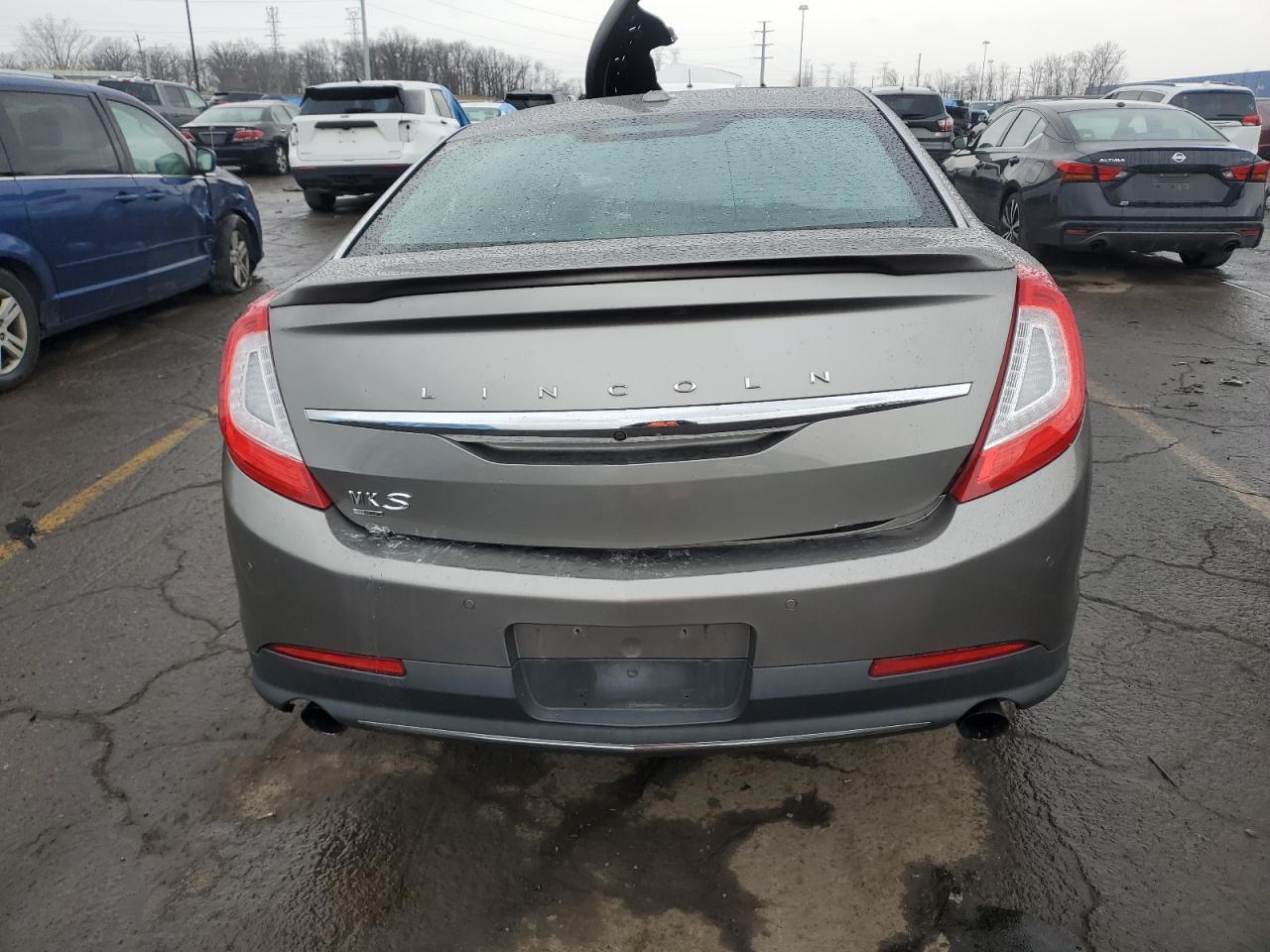 2016 Lincoln MKS VIN 1LNHL9FT0GG600840 Copart auction photo, all over / missing/altered vin damage thumbnail 6