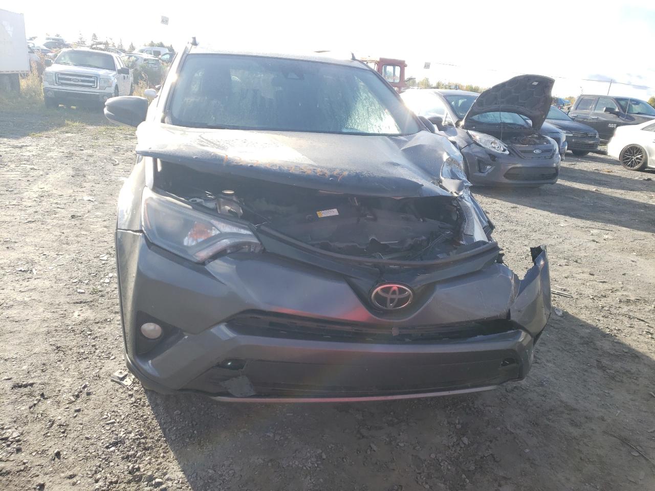 2018 Toyota RAV 4 VIN 2T3RFREV0JW802110 Copart auction photo, all over damage thumbnail 5