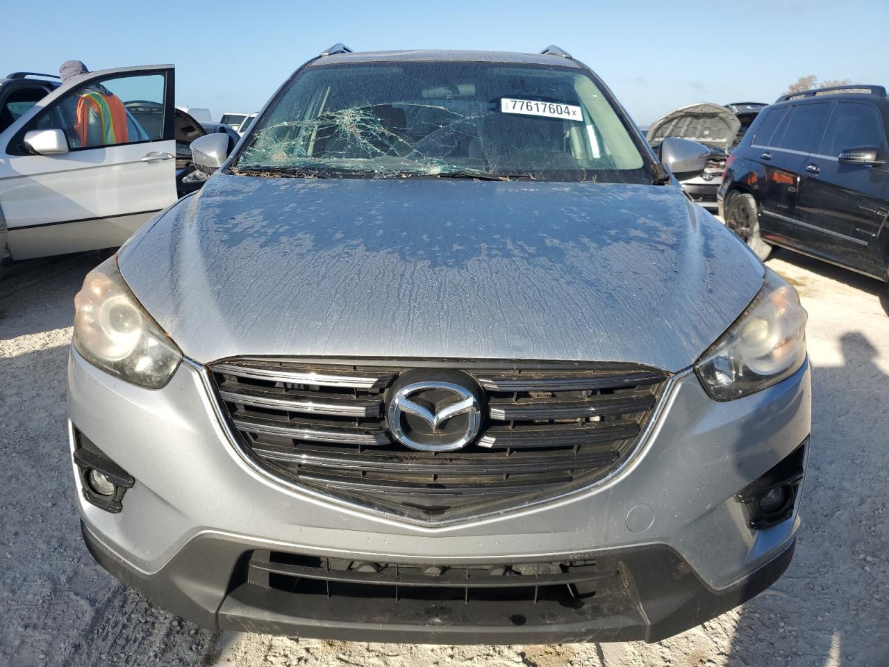 2016 Mazda CX-5 VIN JM3KE2CY4G0638521 Copart auction photo, water/flood damage thumbnail 5